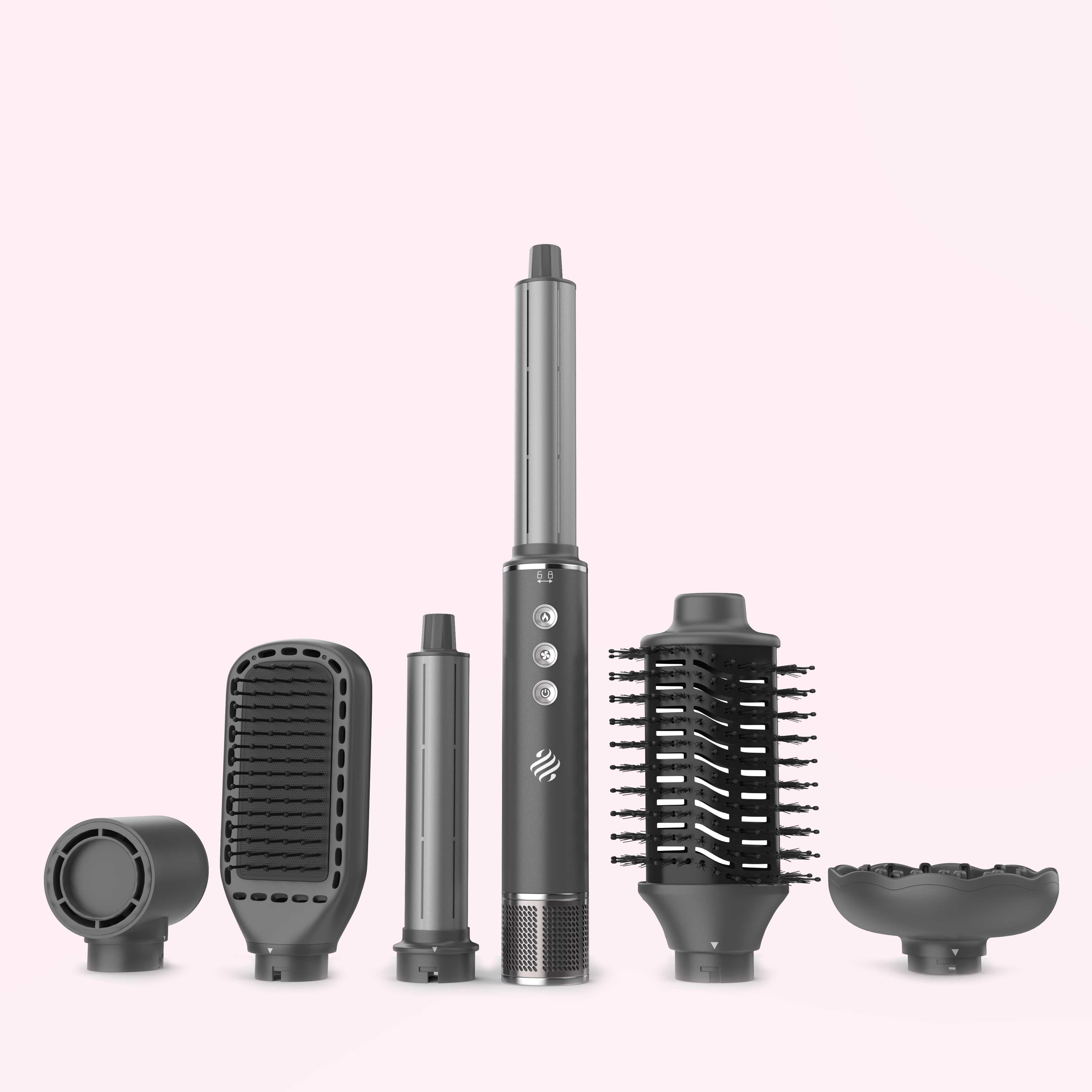 Ace & Taylor Airstyler Pro Ceramiq met alle opzetstukken naast elkaar op een lichtroze achtergrond