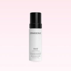 Organicals Shape Foam mousse bottle on a pink background