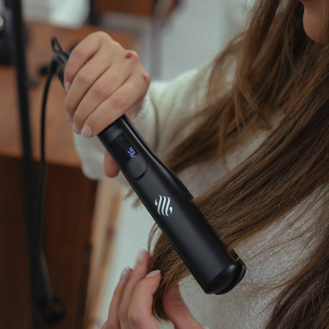 Explore the sleek transformation as this dark-haired beauty effortlessly styles her locks with Ace & Taylor's cutting-edge straightener. Unleash the power of precision and elegance for a radiant, straightened look that captivates.